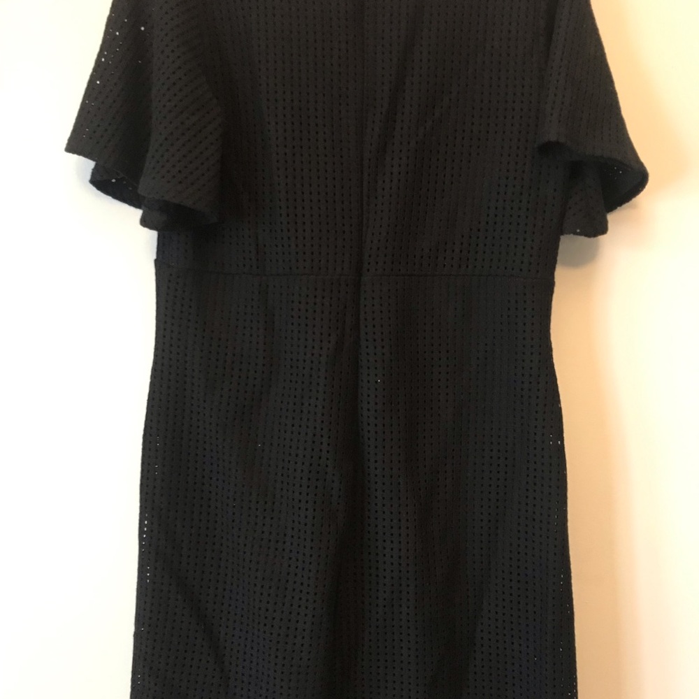 Black dress with angel sleeves.  33” in length.   Cross cross tie in front.
